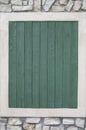 Green wooden frame on rock wall Royalty Free Stock Photo