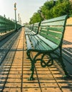 Green Wooden Park Benches in row on Boardwalk, Quebec City, Canada Royalty Free Stock Photo