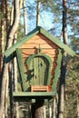 Green wooden treehouse