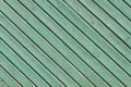 Green wooden wall with diagonal planks