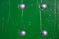 Green wooden wall texture with four bolts Royalty Free Stock Photo