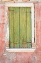 Green wooden window cover of an old house Royalty Free Stock Photo