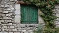 Green window and shutter on stone wall Royalty Free Stock Photo