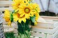 Green wooden yellow flowers photo zone with rustic decorations Royalty Free Stock Photo