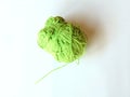 Green wool on a white background for knitting and crocheting Royalty Free Stock Photo