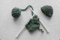 Green wool yarn skein on the white table. Royalty Free Stock Photo