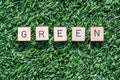 Green word with wood letters on synthetic grass