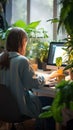 Green work environment Woman working at home with house plants Royalty Free Stock Photo