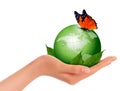 Green world with leaf and butterfly in woman hand. Vector illustration.