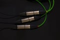 Green of XLR microphone cable on black background Royalty Free Stock Photo