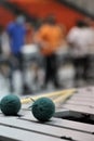 Green yarn mallets on vibraphone with drummers in background Royalty Free Stock Photo