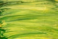 Green and yellow acrylic paint brush strokes texture background. Royalty Free Stock Photo