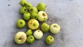Green and yellow apples on a gray board. Fall. Homemade apples. Vegan food.