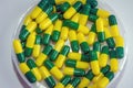 Green yellow capsule drug