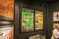 Green and yellow concert posters of Johnny Cash on the wall at the Johnny Cash Museum in Nashville Tennessee