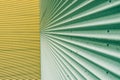 Green and yellow corrugated metal sheet wall background texture Royalty Free Stock Photo