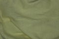 Green yellow fabric texture from a piece of crumpled matter Royalty Free Stock Photo