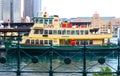 Green and yellow ferry moored in Circular Quay in Sydney NSW Australia circa June 2014