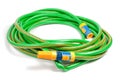 Green and yellow garden water hose Royalty Free Stock Photo