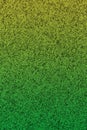 Green and yellow glitter textured paper closeup background