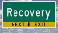 Green and yellow highway sign for RECOVERY