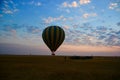 hot air balloon flying over the savannah