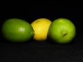 Green and yellow lemon on dark background, can be used commercially Royalty Free Stock Photo