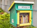 Green and yellow little free library and books