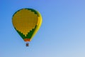 Green & Yellow Patterned Hot Air Balloon In Early Morning