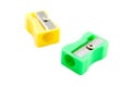 Green and yellow pencil sharpeners Royalty Free Stock Photo