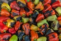 Green and yellow peppers grilling on a BBQ