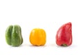 Green yellow red bell pepper onthe white background.