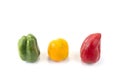 Green yellow red bell pepper onthe white background.