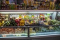 green, yellow, and red bell peppers, onions and mushrooms wrapped in plastic on display in baskets at the Municipal Market Royalty Free Stock Photo