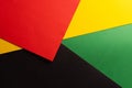 Green, yellow and red papers with copy space on black background Royalty Free Stock Photo