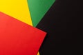 Green, yellow and red papers with copy space on black background Royalty Free Stock Photo