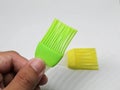 Green and yellow silicone brush for baking cakes