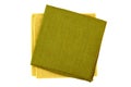 Green and yellow textile napkins on white
