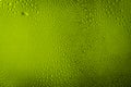 Green, yellow water drops on  green color abstract  background Royalty Free Stock Photo