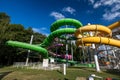 Green and yellow water slide in aquapark Royalty Free Stock Photo