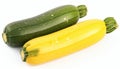 Green and yellow zucchini parallel on a clean white background