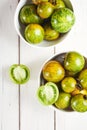 Green zebra tomatoes in a bowl Royalty Free Stock Photo