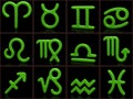 Green zodiac signs on black background