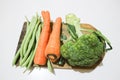 Greenbeans, carrots and broccoli on the wooden board