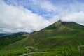 Greenery landscape panorama of Mount Yufu summit with white cloudy sky Royalty Free Stock Photo