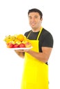 Greengrocer holding fruits