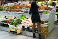 Greengrocer organising fruit and vegetables at the market