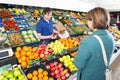 Greengrocer serving a customer Royalty Free Stock Photo