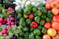 Greengrocers radish tomatoes green red peppers Royalty Free Stock Photo