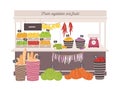 Greengrocery shop with awning or marketplace with fresh fruits, vegetables, scales and price tags. Place for selling